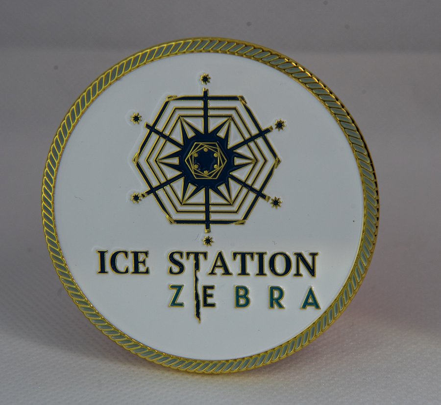 Ice Station Zebra challenge coin with compass rose design and gold rope edge